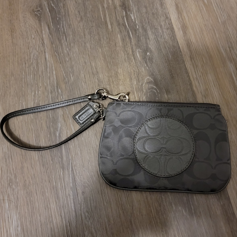 Gray Coach wristlet with pink interior